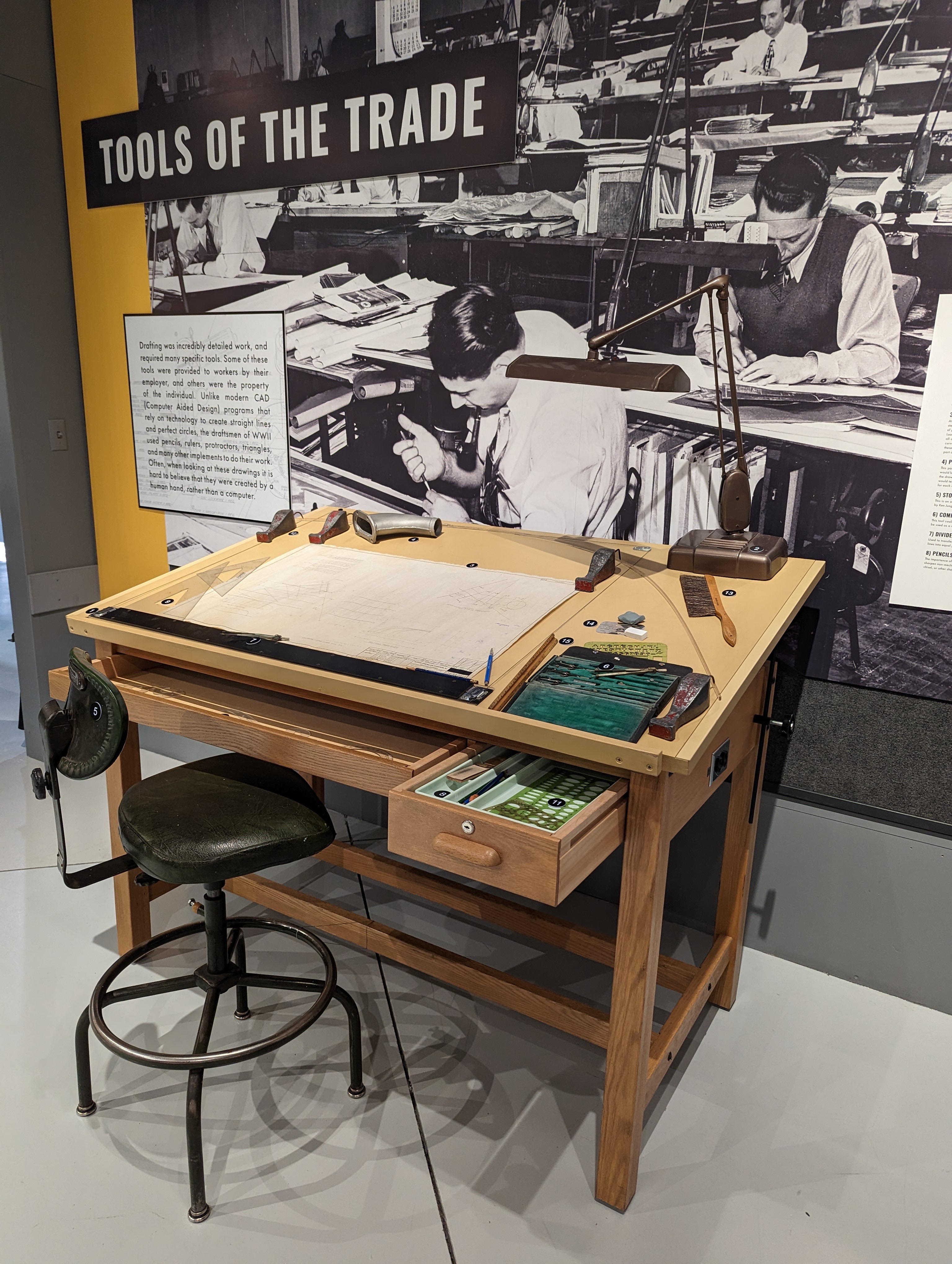 An engineering desk with WWII era drafting tools